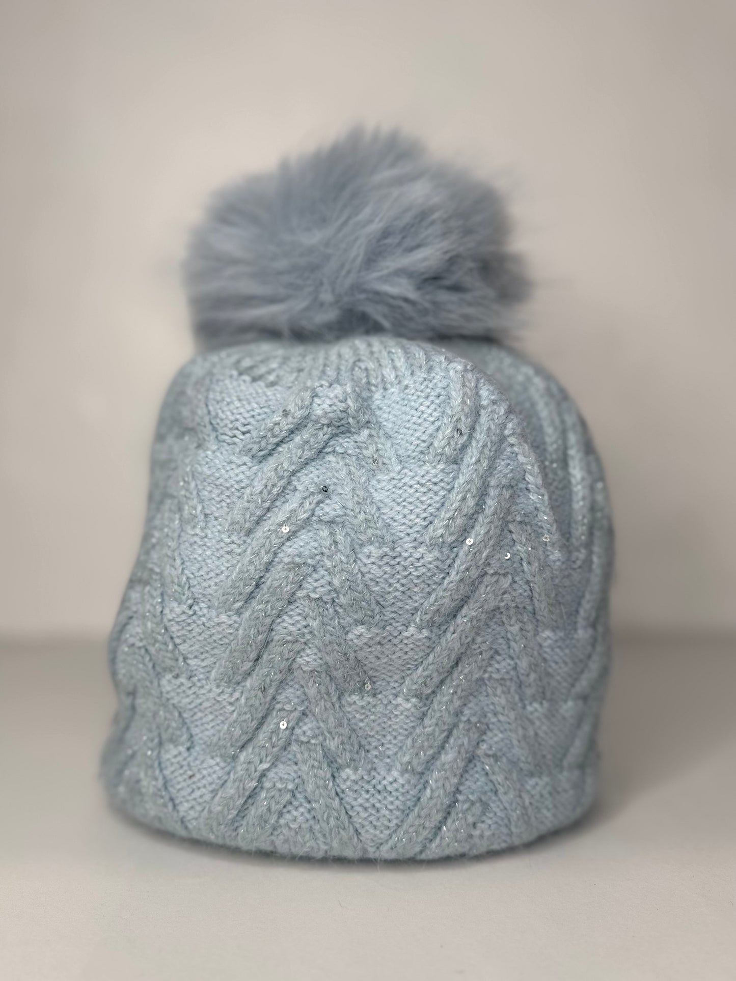Sinead Muted Pastel Wool Blend Cable Knit Faux Fur Pom Pom Hat - Subtle Sequin Trim - Pastel Blue, Soft Grey, Soft Taupe