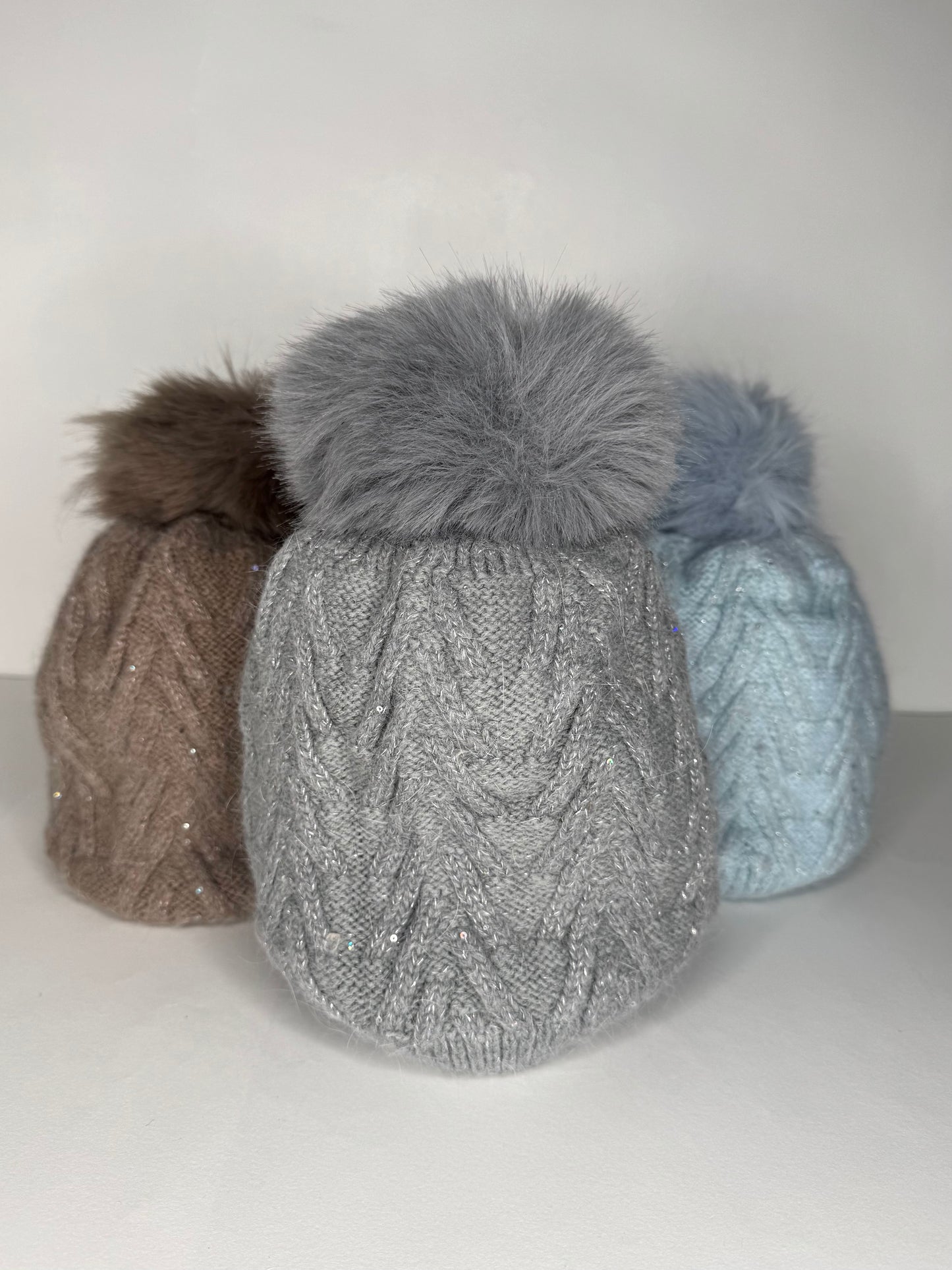 Sinead Muted Pastel Wool Blend Cable Knit Faux Fur Pom Pom Hat - Subtle Sequin Trim - Pastel Blue, Soft Grey, Soft Taupe