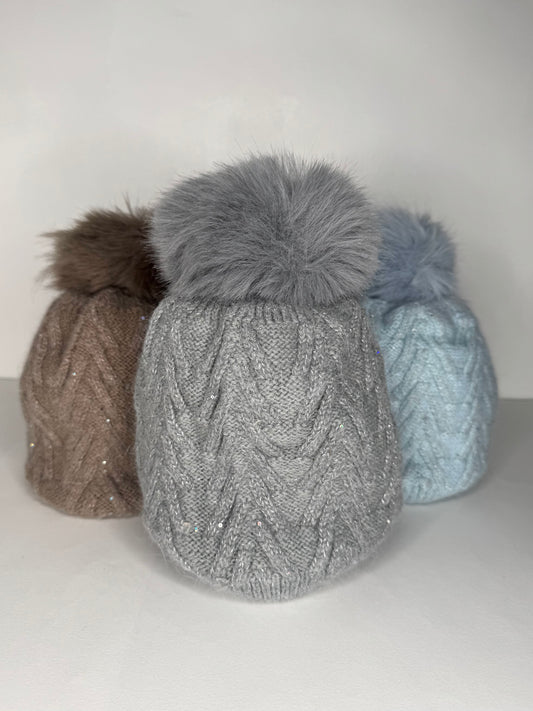 Sinead Muted Pastel Wool Blend Cable Knit Faux Fur Pom Pom Hat - Subtle Sequin Trim - Pastel Blue, Soft Grey, Soft Taupe